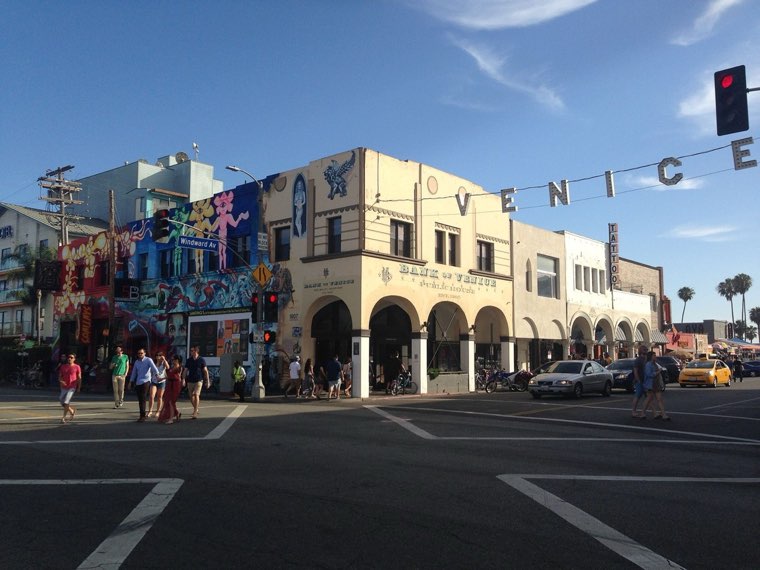Windward Avenue about 1905, under a VENICE banner, and the sign today